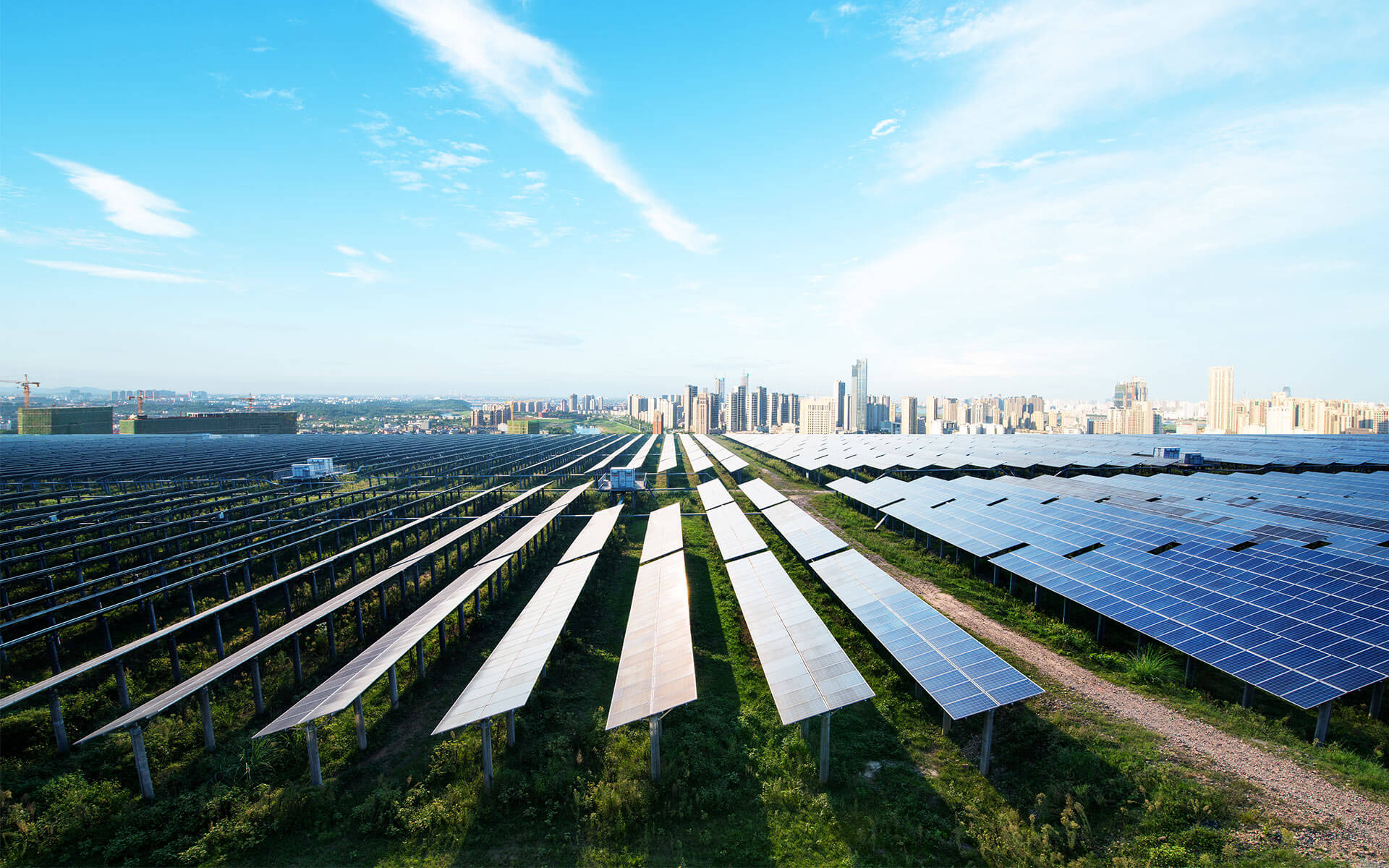 Solar panels - with a view of Los Angeles, California in the distance - providing utility-sale power.