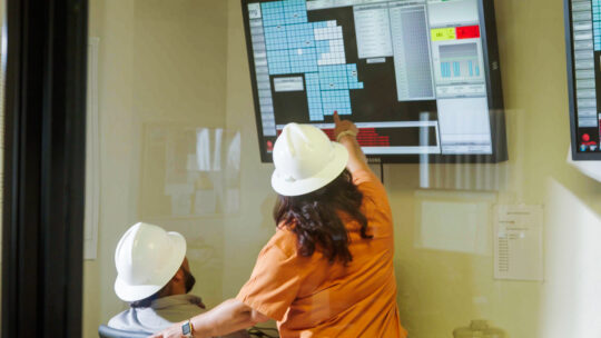 Clean energy worker studying safety system guidelinhes